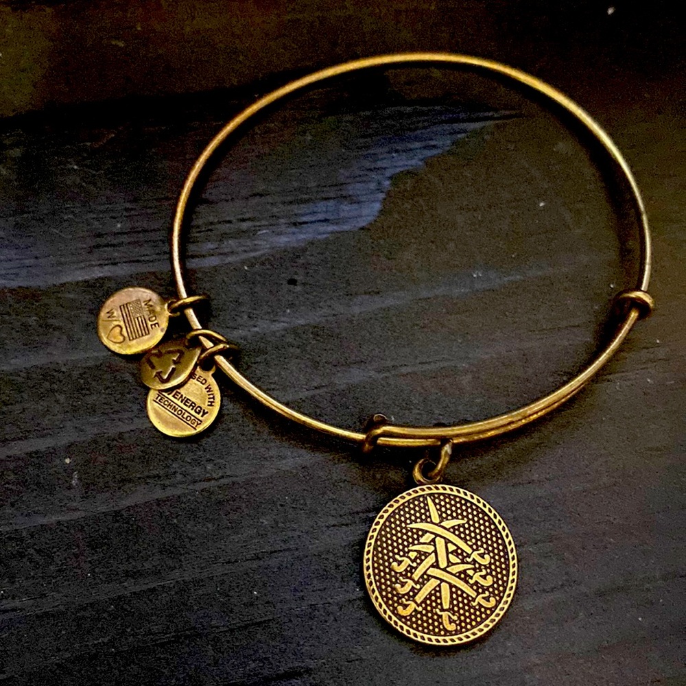 Alex and Ani gold bangle with charm